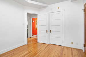 Unfurnished bedroom with wood-type flooring