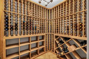 Wine cellar featuring parquet floors