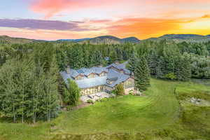 Aerial view at dusk featuring a mountain view