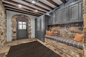 Interior space with beam ceiling and wooden walls