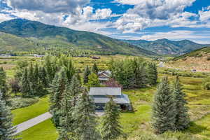 Birds eye view of property with a mountain view