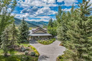 View of front facade featuring a mountain view and a porch