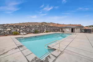 View of swimming pool with a patio area