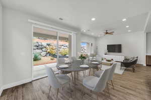 Dining room with ceiling fan and light hardwood / wood-style floors