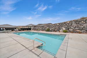 View of swimming pool with a patio area