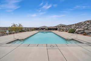 View of swimming pool featuring a patio area