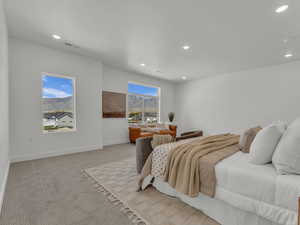 Primary Bedroom featuring light colored carpet, visible vents, and recessed lighting