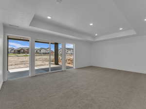 Basement family room leading out to covered porch