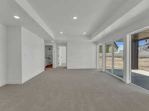 Basement family room leading out to covered porch
