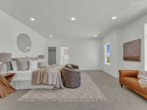 Primary Bedroom featuring recessed lighting, carpet floors, a spacious closet, and baseboards