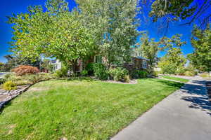 View of front of home featuring a front lawn