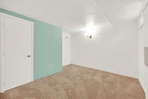 Spare room featuring carpet flooring