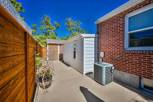 View of patio with central AC unit