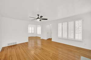 Unfurnished room featuring ceiling fan and light hardwood / wood-style flooring