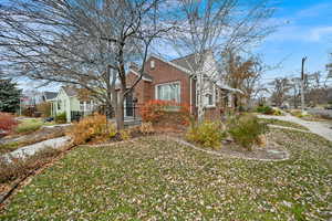 View of property exterior with a lawn