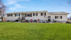 View of front of home featuring a front lawn