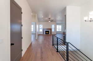 Corridor featuring a chandelier and light hardwood / wood-style flooring