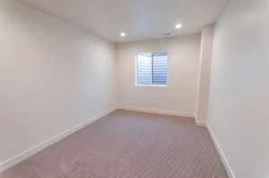 View of carpeted spare room