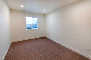 Empty room featuring carpet floors