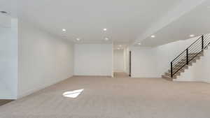 Basement with light carpet