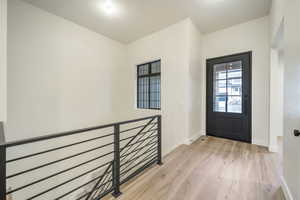 Foyer entrance featuring light hardwood / wood-style flooring