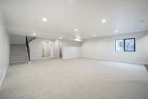 Basement with light colored carpet