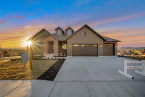 View of front of house featuring a mountain view and a garage