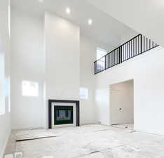 Family room with plenty of natural light and a high ceiling