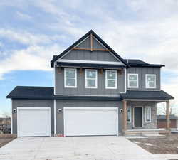 View of front facade with a 3-bay garage