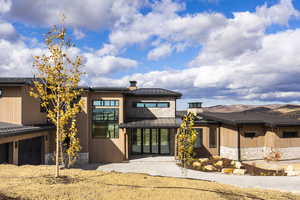 View of front of house with a patio