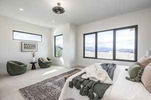 Bedroom featuring a mountain view and carpet floors