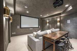 Home theater with light colored carpet