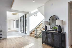 Stairway with hardwood / wood-style floors