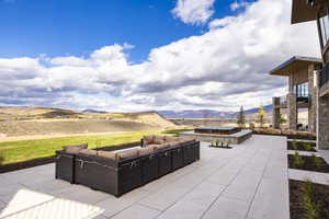 View of patio / terrace with a mountain view and an outdoor hangout area