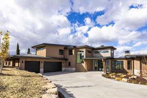 Prairie-style home featuring a garage