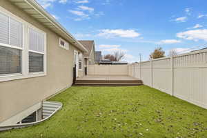 View of yard with a wooden deck