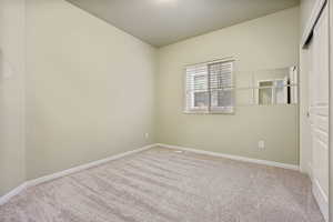 View of carpeted spare room