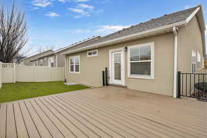 Wooden terrace with a lawn