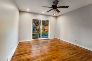 Main floor family room featuring hardwood floors, ceiling fan and sliding glass door to garden.