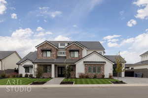 View of front of property with a front lawn