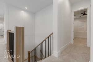 Hallway with light colored carpet