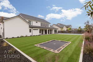 View of sport court featuring a lawn