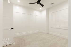 Spare room with light colored carpet and ceiling fan