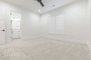 Unfurnished room featuring light carpet and ceiling fan