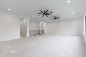 Unfurnished room with light carpet and ceiling fan