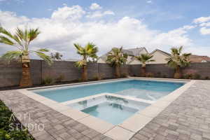 View of pool featuring an in ground hot tub