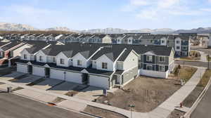 Birds eye view of property with a mountain view