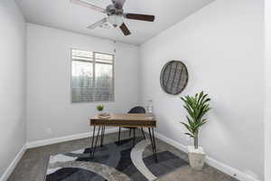 Carpeted office space with ceiling fan