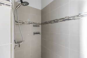 Bathroom featuring a tile shower