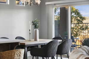 Dining room with a notable chandelier and a wealth of natural light